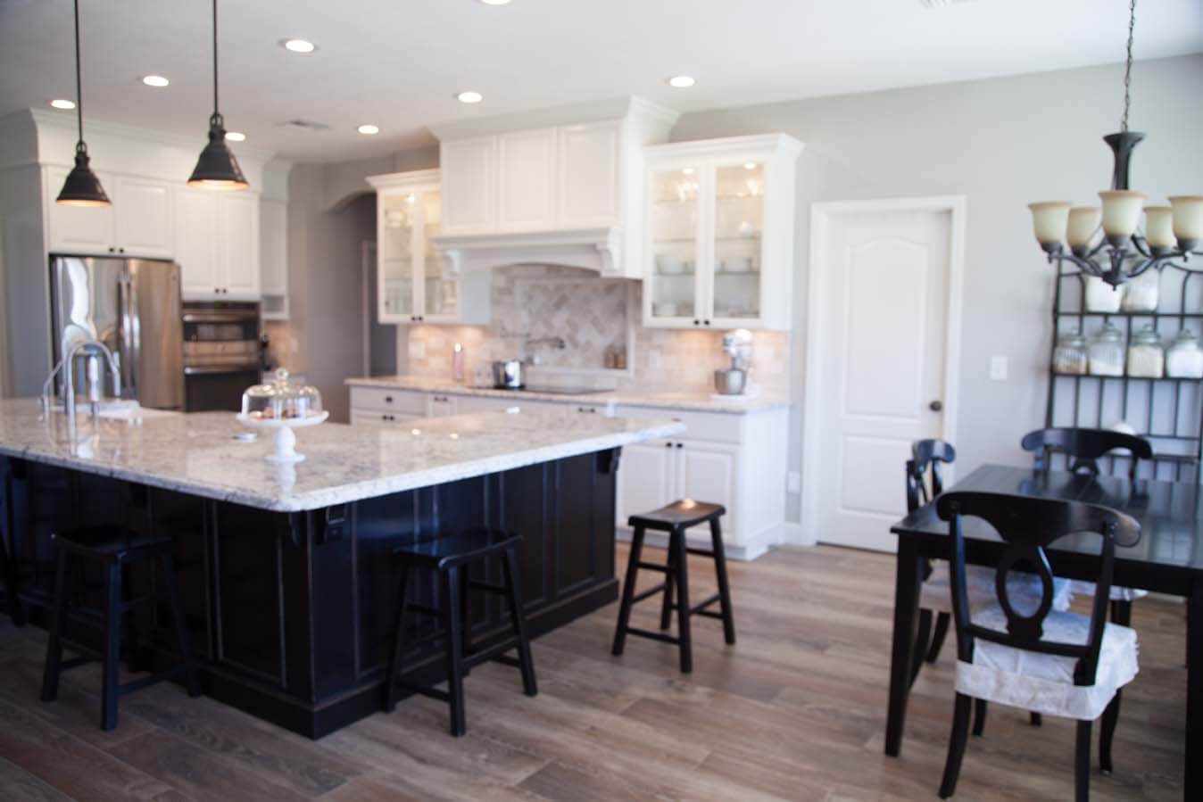 White cabinets dark fixtures remodel